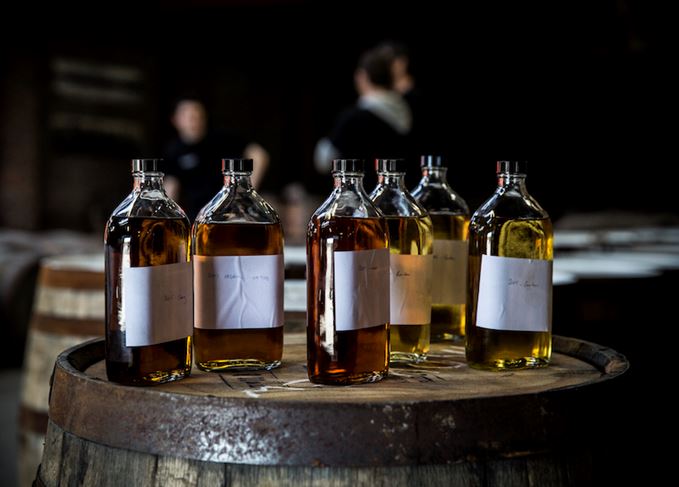 Whisky sample bottles on barrel end