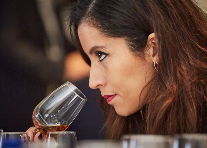 woman nosing whisky glass