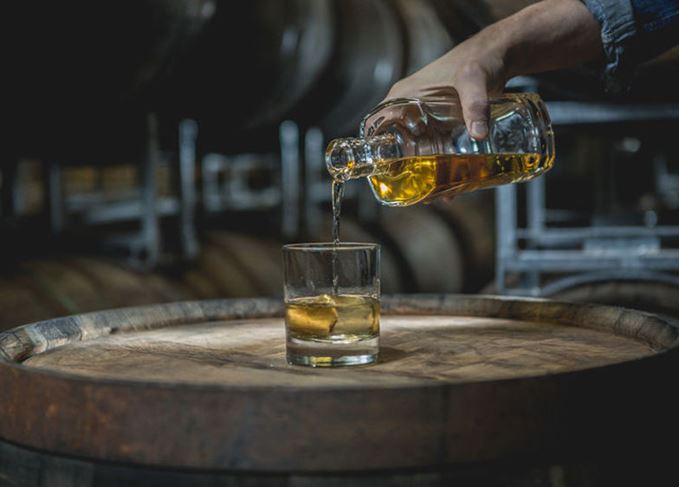 Whiskey being poured into a glass