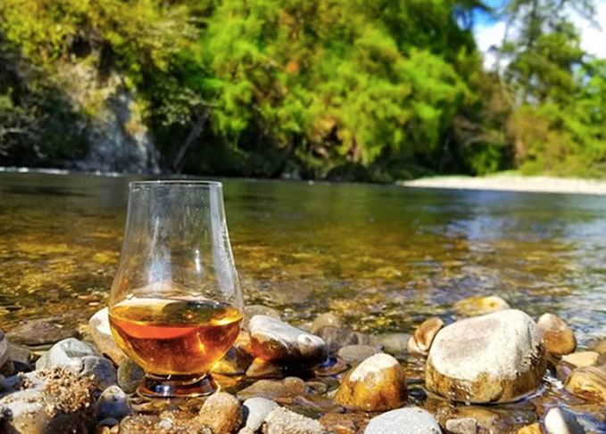 whisky glass on the Spey river