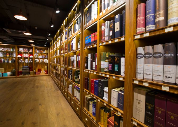 Shelves stocking whisky at The Whisky Exchange Covent Garden