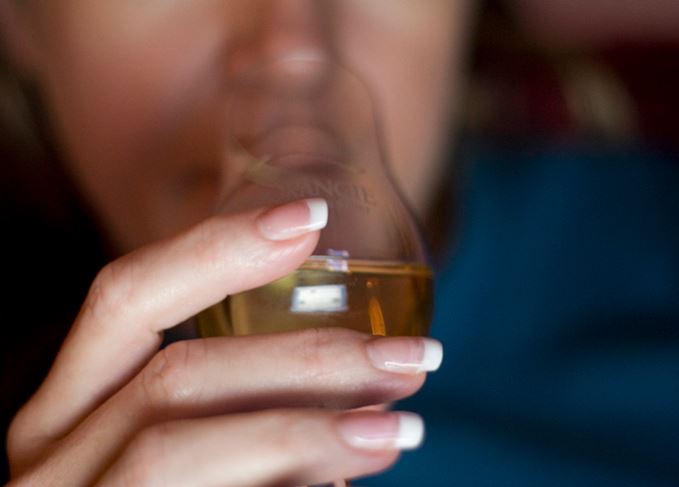 woman tasting whisky