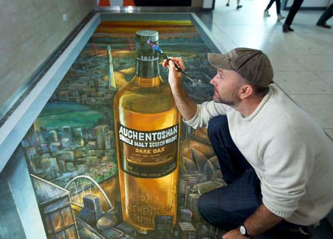 Joe Hill from 3D Joe & Max with the Auchentoshan mural at Edinburgh airport